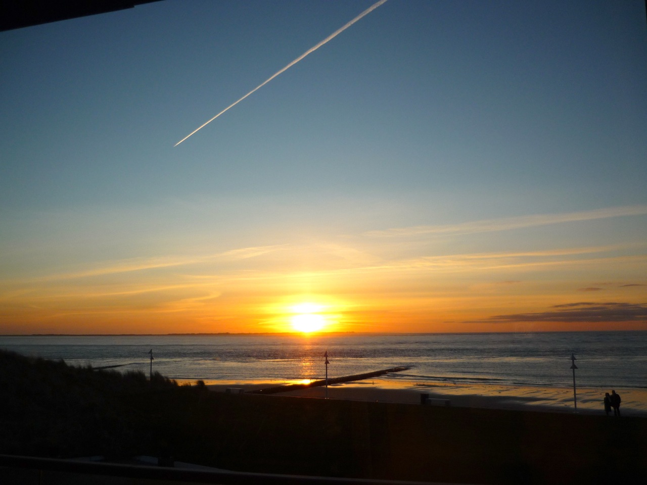großartiger Sonnenuntergang auf Norderney – Blick vom Seesteg